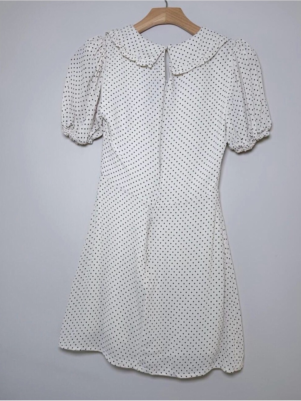 Reformation Kaylia Polka Dot Mini Dress in cream with a black bow - Picture 8 of 9